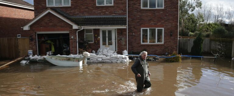 Man20underwater20outside20flooded20home20UK 01 768x315